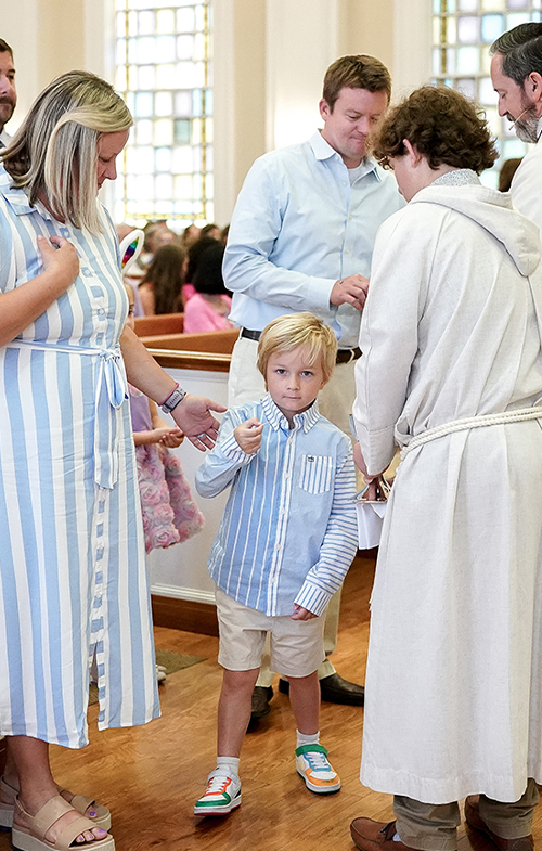 Child with parents in church